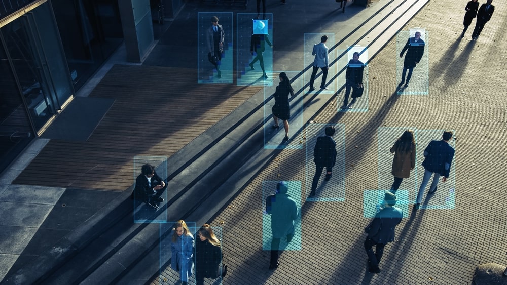 Footage of a Crowd of People Walking on Busy Urban City Streets. CCTV AI Facial Recognition - private investigator new orleans